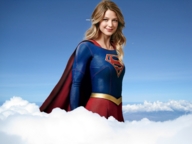 gentle collage mega blonde long_hair clothed smiling supergirl airplane clouds costume cape looking_at_viewer dc_comics cmwaters