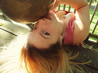 micro blonde long_hair cleavage necklace leaning_back on_lips between_breasts