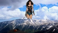 giantess mega black_hair long_hair sword skirt walking mountains wonder_woman shield gauntlets