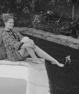 collage monochrome clothed barefoot slave sitting shrunken_man painting_nails outdoors