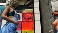 blonde large_breasts long_hair jeans mini_giantess looking_down outdoors digital_render rubbing_stomach dinner-kun
