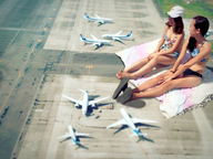 giantess collage city black_hair long_hair barefoot brunette asian sitting airplane laughing giantesses outdoors flip_flops baseball_cap airraid
