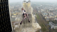 breasts giantess collage city mega long_hair destruction clothed skirt high_heels brunette asian sitting uniform nylons high smoke outdoors sitting_on_building velocity-vektor