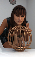 long_hair cleavage brunette domination bending_over shrunken_man cage naked_man mini_skirt digital_render