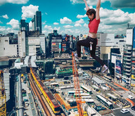 giantess collage city long_hair brunette asian walking outdoors braid arms_raised airraid