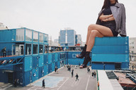 giantess collage toes shoes asian sitting parking_lot jacket containers airraid