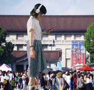 giantess collage black_hair clothed asian dress town walking peaceful cellphone looking_at_phone nonchalant airraid