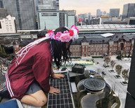 giantess collage city black_hair long_hair skirt asian kneeling looking_down outdoors flowers airraid