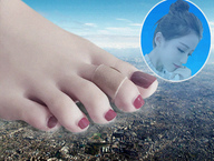 city destruction barefoot bandages smiling short_hair looking_down outdoors red_nails nail_polish hair_bun