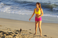 collage long_hair beach barefoot brunette shorts walking shrunken_man outdoors top