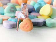 collage blonde large_breasts long_hair cleavage unknown_artist bending_over shrunken_woman candy valentines_day