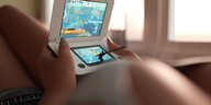 large_breasts handheld cleavage lying_down shorts indoors point_of_view video_games mike973 digital_render giantess_pov stylus super_time_force