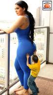 gentle collage black_hair long_hair butt clothed barefoot jeans shrunken_man standing tattoo shirt touching squeezemeflat balcony unitard