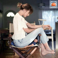 collage clothed barefoot butt_crush jeans brunette domination ponytail shrunken_man looking_down tattoo shirt squeezemeflat directors_chair