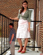 gentle collage long_hair clothed skirt brunette smiling sandals shrunken_man looking_down size_comparison pedicure jacket shirt balcony iggy62