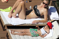 bikini collage blonde long_hair barefoot brunette amazon shorts sunglasses sunbathing lowerrider brooklyn_decker ballcap