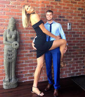 collage blonde long_hair clothed posing sandals amazon hugging statue mini_skirt lowerrider