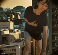 giantess collage city black_hair clothed buildings smiling asian shorts bending_over standing shirt necklace kyojingirls