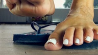 collage toes barefoot shrunken_man pedicure flip_flops floor raised_foot white_nails imminent_crush loryelle
