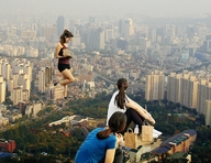 giantess collage city long_hair destruction clothed buildings brunette ponytail sitting walking looking_down giantesses outdoors looking_back chainorchid