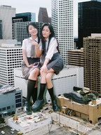 giantess collage city black_hair long_hair buildings smiling sitting giantesses outdoors chainorchid