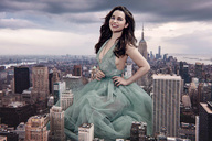 breasts giantess collage city mega long_hair brunette smiling dress kneeling outdoors new_york_city empire_state_building hands_on_hips emilia_clarke