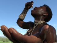 giantess vore black_hair tongue clothed handheld horse short_hair open_mouth dangle dark_skin tattoo native in_palm digital_render vorifax