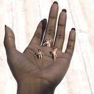 nipples nude handheld topless scared sitting kneeling shrunken_woman dark_skin digital_render loca-lyn