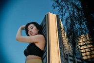breasts giantess collage city mega black_hair long_hair clothed bra asian looking_down leaning_against_building outdoors kyoujingirls
