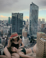 giantess collage city long_hair destruction buildings brunette smiling lying_down giantesses outdoors kyoujingirls