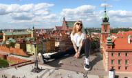 giantess collage city mega blonde color long_hair clothed buildings smiling sitting sunglasses sneakers clouds looking_up sky tattoo nail_polish bracelet vans sitting_on_floor warsaw lagunalela