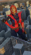 breasts giantess city mega large_breasts long_hair buildings helicopter green_eyes gloves red_hair costume earrings giant_girl belt hands_on_hips digital_render mary_jane spider-man marvel_comics earth_20052 ci0 justasfmusername