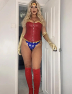 panties blonde long_hair clothed cleavage boots amazon standing penny size_comparison costume wonder_woman looking_at_viewer leotard doorway