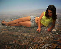 giantess collage mega clothed brunette lying_down unknown_artist shorts reaching hand_crush finger_crush