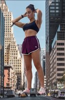 breasts giantess collage city traffic buildings brunette street unknown_artist watch shorts bus vehicles sneakers top bracelet hair_bun bare_legs bare_midriff earbuds