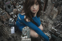 giantess collage city long_hair destruction buildings brunette asian unknown_artist phone crouching sweater looking_at_viewer bare_legs