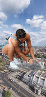 breasts collage city mega destruction cleavage buildings brunette street ponytail shorts sunglasses vehicles sneakers crouching top nike