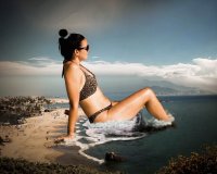 breasts mega black_hair swimsuit beach water ocean unknown_artist sitting waves sunglasses clouds source_needed hair_bun