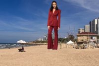 breasts giantess collage city mega long_hair beach water ocean buildings brunette pants pantsuit gal_gadot tel_aviv