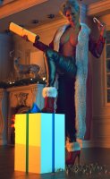 breasts white_hair large_breasts high_heels christmas short_hair shrunken_man pants night indoors santa_costume milf crowds coat fireplace christmas_gift leather_pants digital_render candy_cane looking_at_tinies mrs._claus allthesizepuns