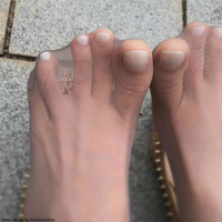 feet toes soles worship shrunken_man trapped outdoors 1girl depth_of_field floor_tiles