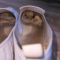 giantess shoes brunette short_hair shrunken_man closed_eyes digital_render wooden_floor solo realistic depth_of_field msku_marklovefeet