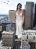 giantess city mega black_hair buildings smiling dress day airplane skyscraper outdoors sky tinies white_dress aircraft solo realistic scenery 1girl photo_background real_world_location