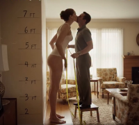 shrunken_man enhanced_art gentle butt barefoot brunette kissing amazon standing size_comparison living_room top measuring stool measuring_tape ai_art