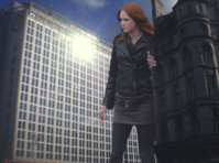 breasts giantess collage mega domination story karen_gillan megagiantess realistic gtsmakerdj city red_hair looking_down between_buildings leather_jacket hand_on_building Mega Megagiantess