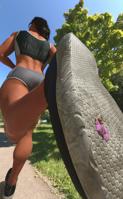 nude black_hair butt shoes ponytail muscles shorts unaware running vehicles dark_skin outdoors road trees gum sports_bra stuck_to_shoe digital_render bare_legs bare_midriff excercise allthesizepuns brunette shrunken_woman