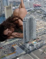 gentle giantess nude city mega butt barefoot brunette lying_down hand face skyscraper