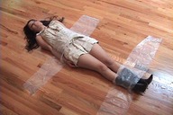 collage black_hair shrunken_woman entrapment taped_down
