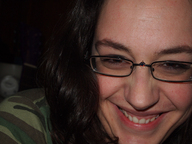 gentle black_hair glasses smiling lips shrunken_men nose