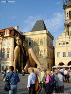 giantess collage city black_hair barefoot sitting people leaning_against_building outdoors